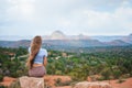 Girl enjoys the view of the Sedona landscape from the top of the Bell Rock hiking trail, famous for its many energy Royalty Free Stock Photo