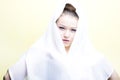 Beautiful girl enveloped in white headscarf Royalty Free Stock Photo