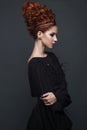 Beautiful girl in evening dress with avant-garde hairstyles. Beauty the face.