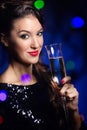 Beautiful girl in evening dress with wine glass. New Year's Eve. Royalty Free Stock Photo