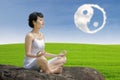 Beautiful girl exercise yoga with ying yang cloud