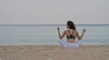 Beautiful girl exercising on the sandy beach Royalty Free Stock Photo