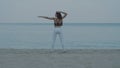 Beautiful girl exercising on the sandy beach Royalty Free Stock Photo