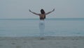 Beautiful girl exercising on the sandy beach Royalty Free Stock Photo