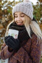 Girl drinking hot tea outdoors in winter Royalty Free Stock Photo