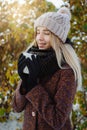 Girl drinking hot tea outdoors in winter Royalty Free Stock Photo