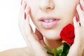 Beautiful girl face close up with a rose in hand Royalty Free Stock Photo