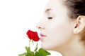 Beautiful girl face close up with a rose in hand Royalty Free Stock Photo