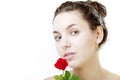 Beautiful girl face close up with a rose in hand Royalty Free Stock Photo