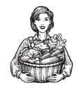 Beautiful girl or happy farmer holding a wicker basket full of vegetables. Agriculture, horticulture, farm concept. Hand