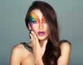 Beautiful girl with a fashion bright multicolored makeup of eyes Royalty Free Stock Photo