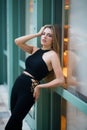 Beautiful girl. Fashion model wearing fashionable clothes, posing in the city. Fashion photo of pretty young woman Royalty Free Stock Photo