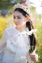 Beautiful girl With a field of flowers