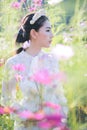 Beautiful girl With a field of flowers