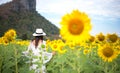 Beautiful girl in field of sunflowers, so happy and relax, Royalty Free Stock Photo