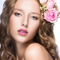 Beautiful girl with flowers in her hair and pink makeup. Spring image. Beauty face. Royalty Free Stock Photo