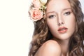 Beautiful girl with flowers in her hair and pink makeup. Spring image. Beauty face. Royalty Free Stock Photo