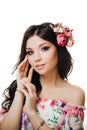 Beautiful girl with flowers. Spring woman. Lady with bright makeup and a flowering branch in her hair. Spring time Royalty Free Stock Photo