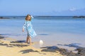 Beautiful girl found on the tropical beach huge big seashell, Mauritius island Royalty Free Stock Photo