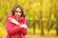 Beautiful girl freezing in autumn park Royalty Free Stock Photo