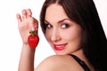 Beautiful girl with a fresh juicy strawberry Royalty Free Stock Photo