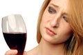 Beautiful girl frowns on alcohol Royalty Free Stock Photo