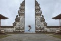 Beautiful Girl Full-Length Portrait Near Gates Of Heaven In Pura Lempuyang Temple In Bali, Indonesia.