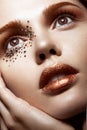 Beautiful girl with a gentle make-up and crystals on the face. Close-up portrait. Royalty Free Stock Photo