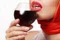 Beautiful girl with a glass of red wine in hand, lips Royalty Free Stock Photo