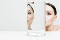Beautiful girl in glass with water. clean skin young woman