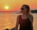 Beautiful girl in glasses at sunset in Europe