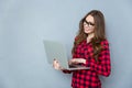 Beautiful girl in glasses using laptop Royalty Free Stock Photo