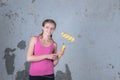 A beautiful girl is going to make repairs in the apartment and i Royalty Free Stock Photo