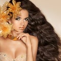 Beautiful Girl With Golden Flowers. Beauty Model Woman Face. Per Royalty Free Stock Photo