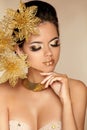 Beautiful Girl With Golden Flowers. Royalty Free Stock Photo