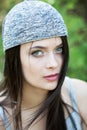 Beautiful girl with green eyes in city park. Woman beauty face portrait Royalty Free Stock Photo