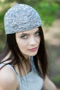 Beautiful girl with green eyes in city park. Woman beauty face portrait Royalty Free Stock Photo