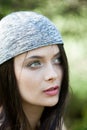 Beautiful girl with green eyes in city park. Woman beauty face portrait Royalty Free Stock Photo