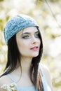 Beautiful girl with green eyes in city park. Woman beauty face portrait Royalty Free Stock Photo