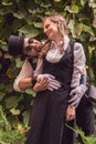 Beautiful girl with a guy, couple in love, in steampunk clothes