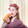 Beautiful girl in hair curlers isolated with hot Royalty Free Stock Photo