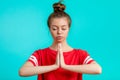 Beautiful girl with hairbun is concentrated on yoga Royalty Free Stock Photo
