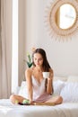 Beautiful girl having breakfast in bed at home Royalty Free Stock Photo