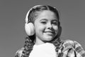 Beautiful girl with headphones. Young happy girl is listening to music. Stylish music lover. Happy smile on girl face Royalty Free Stock Photo