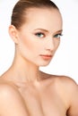 Beautiful girl with healthy spotless skin naked shoulders side-view skincare Royalty Free Stock Photo