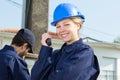 beautiful girl in helmet using walkie talkie outdoors Royalty Free Stock Photo