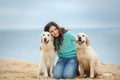 Beautiful girl with her dog near sea Royalty Free Stock Photo