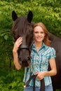 Beautiful girl and her handsome horse Royalty Free Stock Photo
