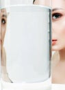 Beautiful girl and her reflection in glass with water Royalty Free Stock Photo