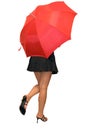 Beautiful girl hiding under red umbrella Royalty Free Stock Photo